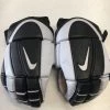 ELEVATESPORTING Used Nike Black/White JR Size 10"/11" Hockey Gloves